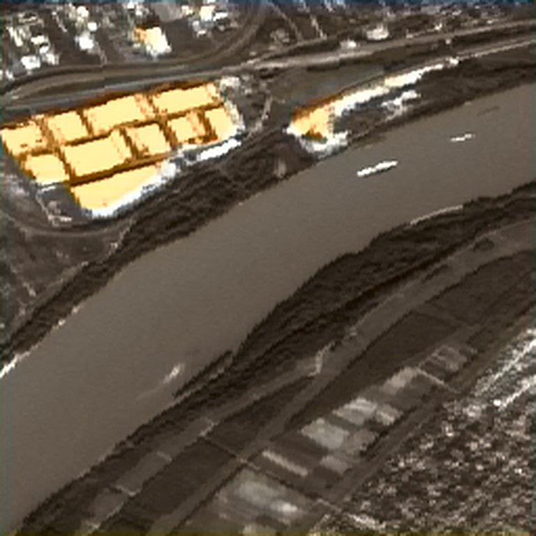 A colorized SAR image of a river and an urban district